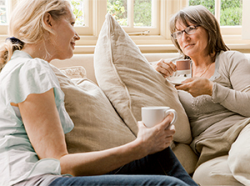 two adults drinking coffee