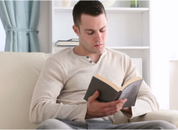adult reading a book